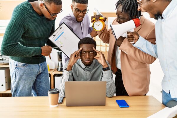 Group,Of,African,American,Business,Workers,Screaming,To,Stressed,Partner