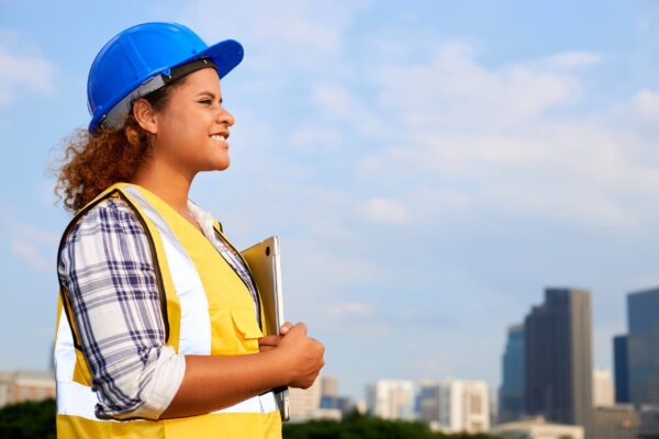 A,Woman,Engineer,Or,Architect,Stands,Outdoors,In,A,City