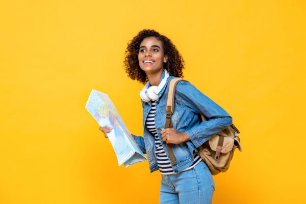 Young,Happy,African,American,Woman,Tourist,Backpacker,With,World,Map