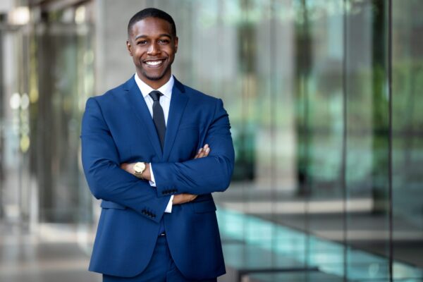 Smiling,African,American,Businessman,Ceo,Standing,Proud,With,Arms,Crossed