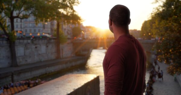 African-american,Male,Traveling,In,Paris,Watches,Beautiful,Sunset